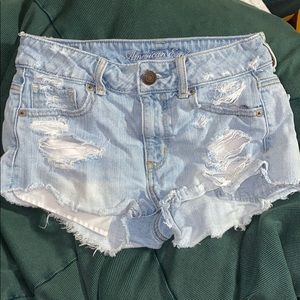 Light blue ripped jean denim shorts